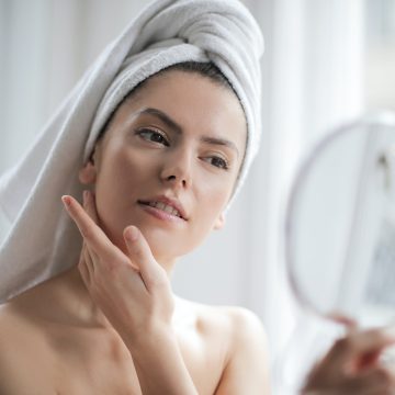 woman skin care mirror