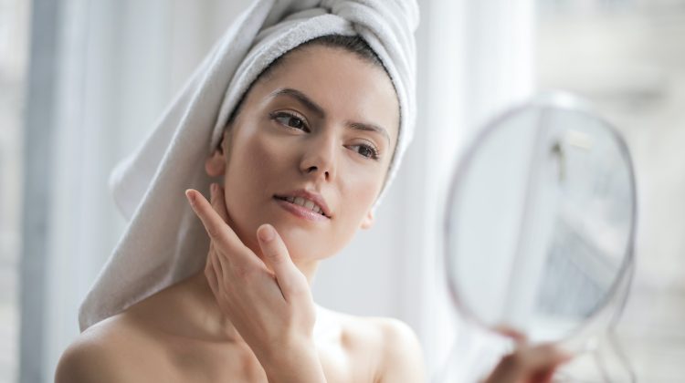woman skin care mirror